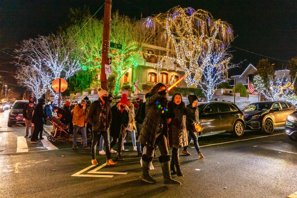 From Manhattan: 4-Hour Dyker Heights Holiday Lights Bus Tour - Dyker Heights on foot: narrow streets, two illuminated streets, and the Lucy Spata story