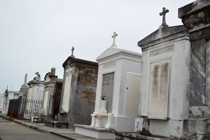 New Orleans Cemetery Bus Tour with Exclusive Cemetery Access - Driving past Cypress Grove and Greenwood: why the architecture looks different