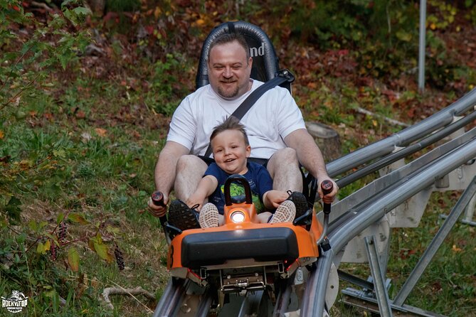 Rocky Top Mountain Coaster Admission Ticket in Pigeon Forge - Day vs. night in Pigeon Forge: lights, music, and Halloween energy